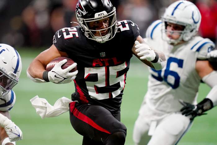 Dec 24, 2023; Atlanta, Georgia, USA; Atlanta Falcons running back Tyler Allgeier (25) carries the ball against the Indianapolis Colts during the fourth quarter at Mercedes-Benz Stadium.